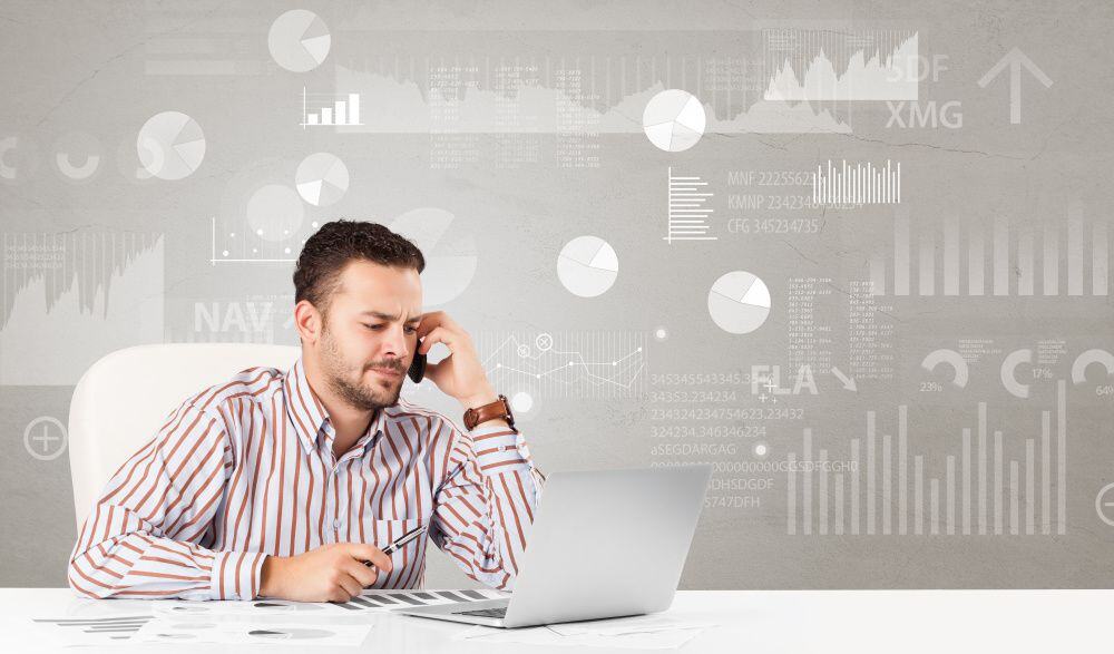 Business person sitting at desk with financial change, and report diagram concept