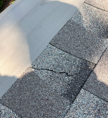 gutter helmet tear on shingles