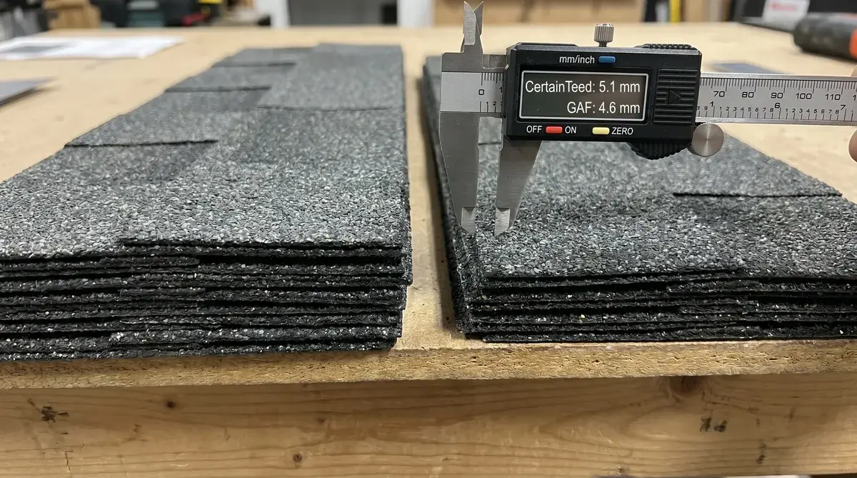 Close-up comparison showing the thickness difference between CertainTeed and GAF architectural shingles